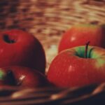 red apples on brown woven basket