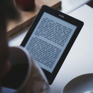 turned on black Amazon Kindle e-book reader